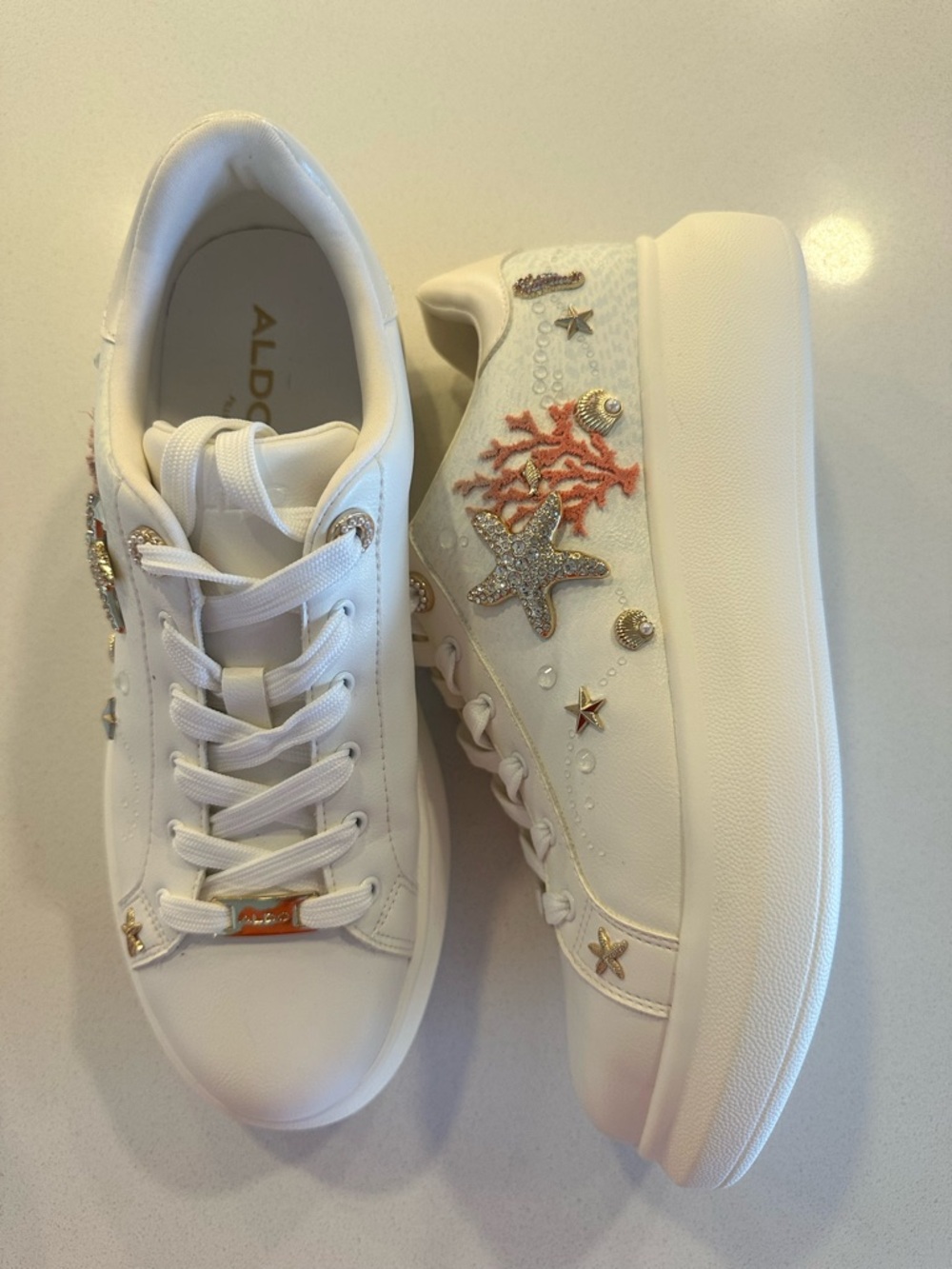 ALDO White Platform Sneakers with Coral Embroidery & Gold Accents